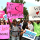 Onlookers cheer after the Supreme Court upholds President Obama's Affordable Care Act (AFP/Getty Images)